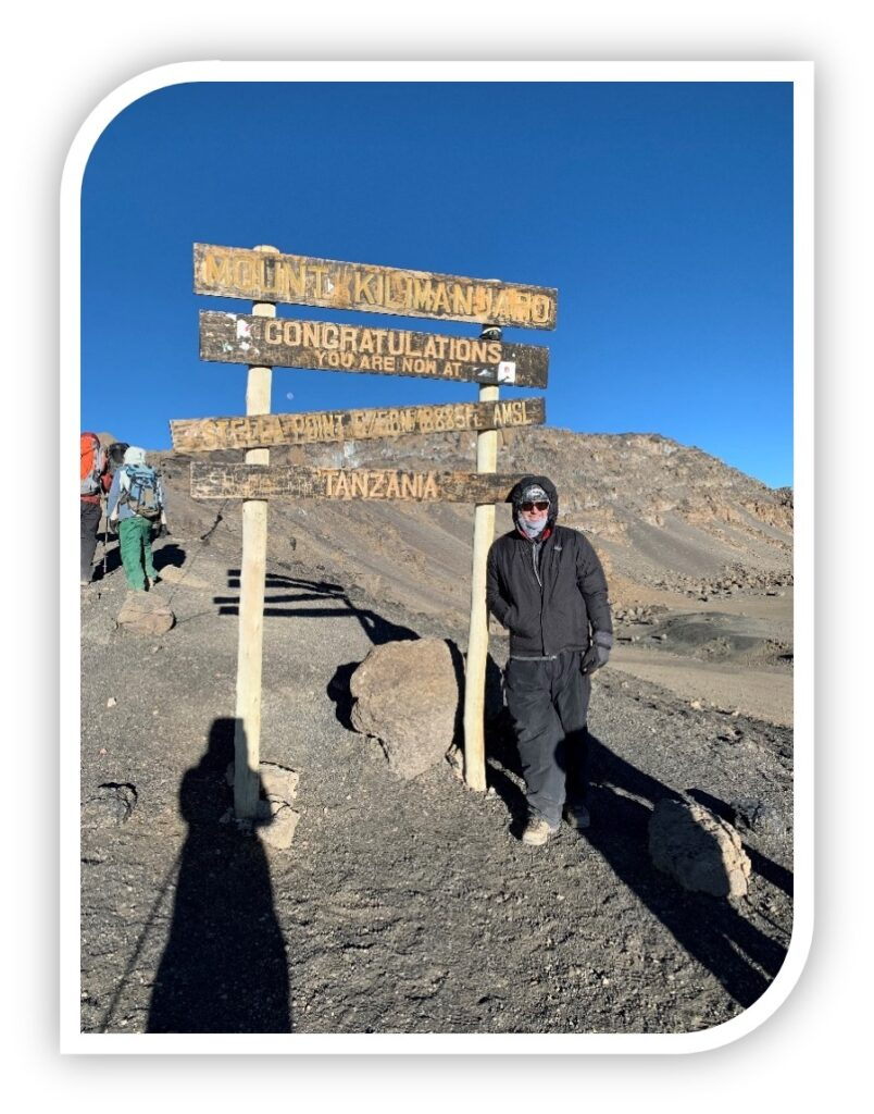 Photo of Greg Pelletier at the Top of Kilimanjaro.